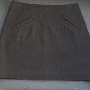 Black wool A-line skirt.